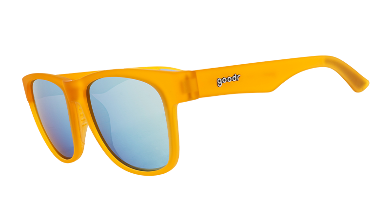 Three-quarter angle view of wide-fit orange sunglasses with square light blue reflective lenses.