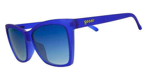 Three-quarter angle view of blue angled cat-eye sunglasses with blue gradient lenses.